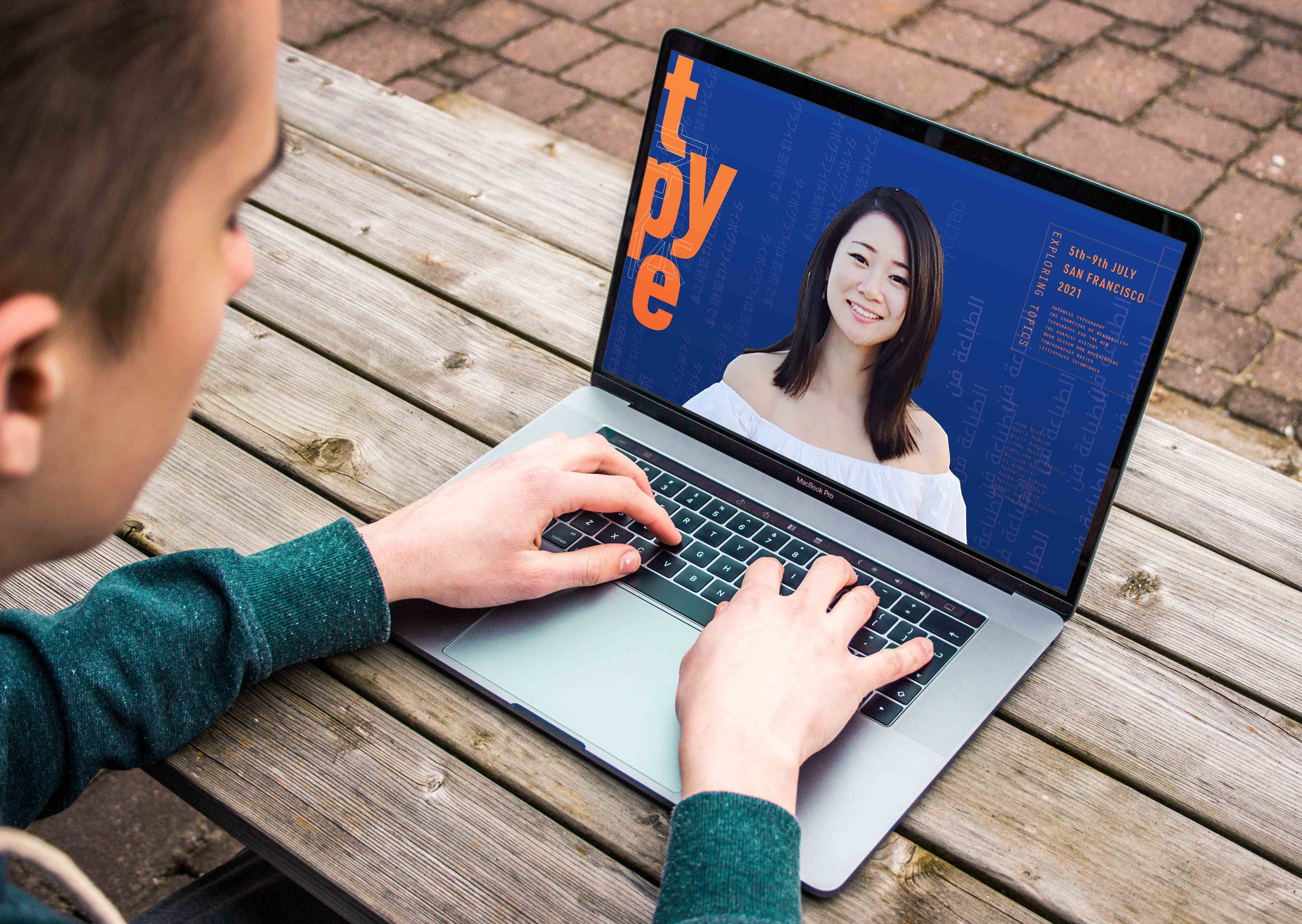 MacBook Pro displaying the TYPE conference website with navy blue background, orange typography, and speaker presentation interface